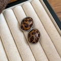 Close-up of vintage leopard print oval stud earrings with silver twisted metal edges - Silver Brown Irregular Style (13#)