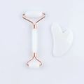 Close-up of dual-head facial roller and heart-shaped gua sha tool set in white resin - Resin Roller White