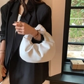 Elegant white pleated cloud handbag for women shown with a stylish black blazer - White