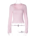 Detailed view of pink long sleeve top featuring delicate lace trim on neck and cuffs - S / Light Pink