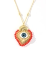Detail of 18k gold heart pendant with evil eye design and red beads on chain - Red