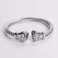 Detail of stainless steel cable twist bracelet featuring realistic fist embossed ends - Steel