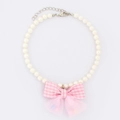 Elegant pearl pet collar featuring a pink checkered bow and soft mesh decoration - Pink