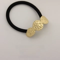 Minimalist black elastic hair tie with three hammered gold textured metal disks - Three Circles Gold