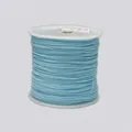 Detailed view of light blue 0.8mm braided cord wound neatly on a white plastic spool - Color 02 Light Blue