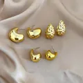 Golden 6-piece geometric stud earring set with waterdrop and heart shapes on silk cloth - 6-Piece Set / Gold