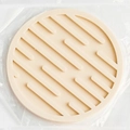 Beige round silicone cup coaster with thick non-slip ridges in clear packaging - Drain Style / White