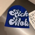Detailed knit texture of royal blue beanie with white Rich Mob letter jacquard pattern - Sapphire Blue