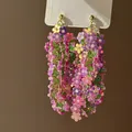 Macro detail of floral drop earrings featuring layered colorful sequins and green beads - 25# Silver Earring Post-Green-Pink