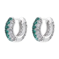 Detailed view of silver huggie earrings with emerald green and clear cubic zirconia - Platinum Green Zirconia