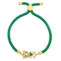 Detail view of woven green cord bracelet with crystal bear charm and green heart stone - Green