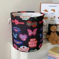 Black canvas laundry basket with vintage cartoon motifs and rope handles for home storage - Vintage Heart