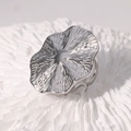 Close-up of silver geometric ring with unique wavy texture on white coral surface - Wave Texture Large Disc (JR590-Steel Color)