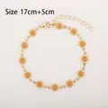 Golden daisy chain bracelet with 14 yellow enamel floral pendants and lobster clasp - Small Flower Bracelet / Yellow
