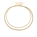 Detail of golden layered twisted chain necklace with lobster clasp on white background - Gold