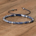 Adjustable woven bracelet with blue marble stones and silver spacers on dark wood - No.38 Blue Spot Jasper