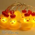 Christmas LED string lights with 10 yellow ducks wearing red hats and warm lighting - King Duck (1.8m 10 LEDs - 2AA Constant Light Battery Box)