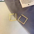 Macro view of geometric square gold earrings with a fine brushed metallic finish - Modern Minimalist Gold Brushed Square Style (A27)