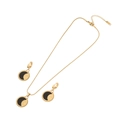 Schmuckset aus goldenem Edelstahl mit Sonnen- und Mondanhänger auf schwarzem runden Untergrund - Emaille Sonne Mond Yin Yang (Schwarz) / Schwarz