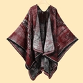 Detailed view of the red and black jacquard knit poncho with an irregular hemline - 130x150cm / Jiangnan Water Town Wine Red
