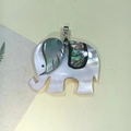 Detailed close-up of elephant shell pendant with abalone shell inlay and silver clasp - C10698-White Shell with Multi-color Abalone (Elephant)