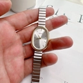 Elegant oval dial women's quartz watch with gold metal case and silver chain strap - Silver Band Gold Case White Dial
