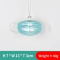 Blue face mask Christmas tree ornament with white glitter edges and silver hanging cord - Blue Mask Ornament