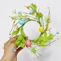 Easter egg candle ring with vibrant green leaves and colorful berries for home decor - Easter Egg Green Leaf Candle Ring