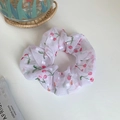 White organza scrunchie with red cherry print featuring a sheer iridescent finish - White Cherry