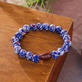 Handmade beaded bracelet with blue red white stone beads and brown football centerpiece - Blue White Red Rugby Bracelet
