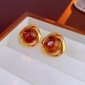 Detailed close-up of vintage tiger eye stone earrings with amber resin and gold frames - 925 Sterling Silver Earring Post-Coffee-Triangular