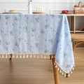 Light blue cotton linen tablecloth with white daisy pattern and tassel fringe trim - Elegant Blue Floral