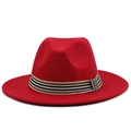 Detail of red wool fedora hat featuring a wide brim and striped decorative band - Red