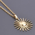 Elegant gold sun pendant necklace with sleek box chain on a minimalist grey background - Necklace / Gold