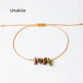 Pulsera artesanal de cuerda trenzada amarilla con piedras Unakite naturales tipo boho - Unakita