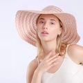 Women summer lace straw sun hat with wide brim and elegant hollow crochet pattern - Pink