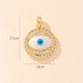Gold evil eye pendant with blue resin and zircon crystals, measuring 1.8cm by 2.5cm - Gold Round Evil Eye Zircon Border Pendant (31)