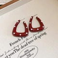 Macro detail of red enamel U-shaped earrings with white polka dots on aesthetic background - 39# Steel Earring Post - Wine Red - U-Shape