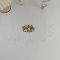 Oval white lace placemat with pink rose embroidery and floral decorative borders - White