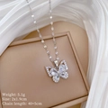 Macro detail of silver butterfly pendant with cubic zirconia, size 2x1.9cm and 5.1g weight - Titanium Steel Chain + Copper Pendant + Zircon / Silver Butterfly Necklace (E502)