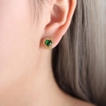 Elegant gold heart stud earrings featuring green gemstone and zircon halo on model - F887-Heart Green Glass Stone