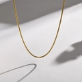 Detail of a polished golden square snake bone chain necklace with metallic luster - 40cm Length / Gold-1.5mm Width