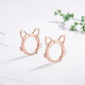 Detailed close-up of rose gold cat-ear shaped earrings on white card background - Hollow Cat Earrings-Rose Gold