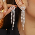 Sparkling silver heart-shaped tassel earrings with pavé zircons worn by a model - Silver Heart Multilayer Tassel Style (DTE1617114S-W)