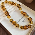 Vintage amber leopard print bead necklace with gold cylinder spacers in a wooden tray - 46# Necklace-Brown-Geometric (Leopard Amber)