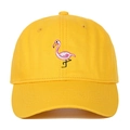 Close-up of pink flamingo embroidery detail on a yellow cotton baseball cap - Yellow
