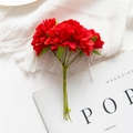 Artificial red flower bouquet on white knit blanket for wedding floral decorations - Red