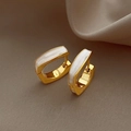 Detail of gold rectangular earrings with white shell inlay on soft silk background - EH-374-White Enamel