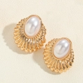 Elegant gold earrings featuring vintage shell-textured metal and oval pearls - White Pearl