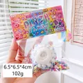 Pinch Family soft white rose squishy toy with colorful sprinkles in 102g retail packaging - Blue Cake